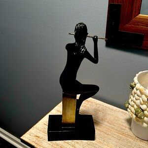 Black female sculpture with flute. Great shape